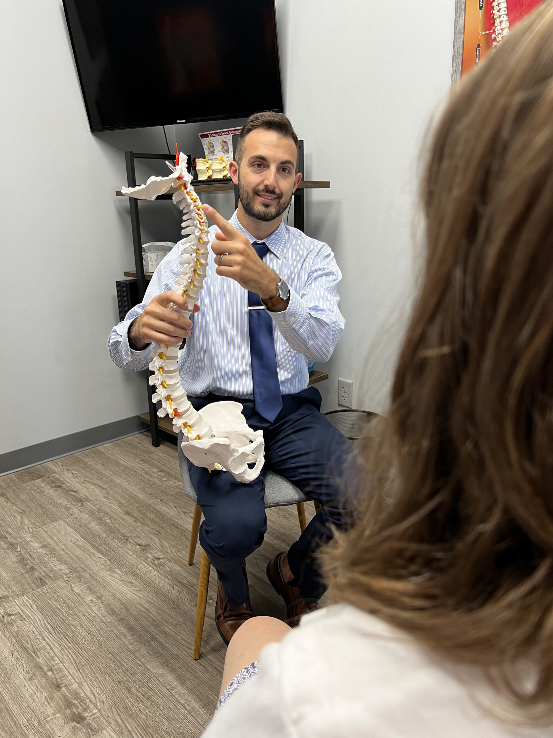 Chiropractor adjusting a patient's back