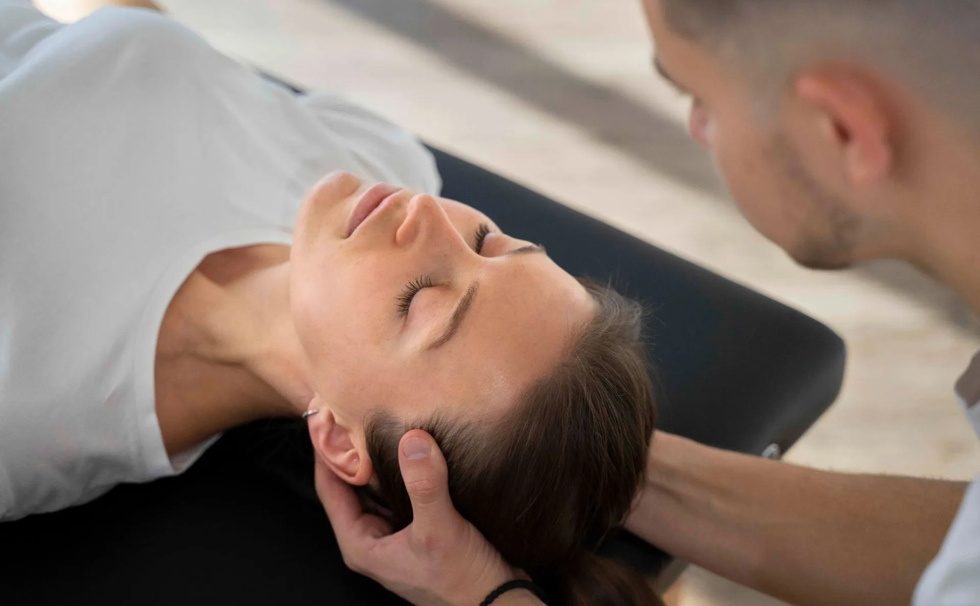 Can Chiropractic Care Help Headaches and Migraines? Chiropractor consulting with a patient at True Grit Health Center in Wentzville, MO