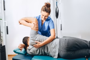 Signs You Should See a Chiropractor receiving chiropractic adjustment at True Grit Health Center